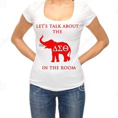 a woman wearing a t - shirt that says, let's talk about the zoo in the room