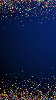 multicolored confetti sprinkles on dark blue background with space for text