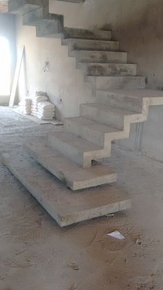 the stairs are made of concrete and have been painted white