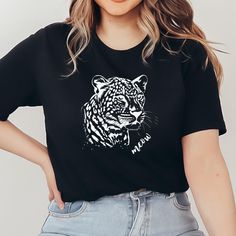 This unisex t-shirt with an impressive leopard head design is a must-have for all animal lovers and fashion-conscious people. 🐆 Show off your wild style with this unique and eye-catching design. Ideal for everyday use, leisure and as a special gift. High-quality, long-lasting print Perfect for animal lovers and fashionistas 🐾 Soft and comfortable material Available in different sizes Ideal for leisure, going out and special occasions Eye-catching and stylish design that attracts attention Mate Casual Leopard Print Crew Neck T-shirt, Leopard Print T-shirt With Letter Print And Crew Neck, Trendy Cotton T-shirt In Leopard Print, Trendy Leopard Print Graphic T-shirt, Trendy Leopard Print T-shirt With Crew Neck, Black Relaxed Fit T-shirt With Cat Print, Leopard Print Graphic T-shirt For Summer, Summer Leopard Print Graphic T-shirt, Graphic Tee With Leopard Print And Crew Neck