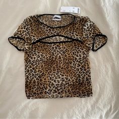 Urban Outfitters Mesh Cheetah Print Crop Top Never Worn Perfect Condition Fitted Black Top With Tiger Print, Fitted Black Tiger Print Top, Casual Fitted Top With Tiger Print, Stretch Tiger Print Top For Summer, Brown Tiger Print Top For Spring, Brown Tiger Print Tops For Spring, Spring Brown Tiger Print Tops, Cheetah Print Crop Top, Print Crop Tops