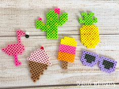 four perler bead cactus brooches with sunglasses on them, one in the shape of an ice cream cone and one in the shape of a pineapple