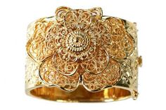 Vintage-style gold metal bracelet with center flower, based on a 1930's style bracelet. Measures 2-1/4" x 2-1/2" Grey Gardens® ships globally. For all international orders, please send us an email at info@greygardensofficial.com and we will invoice you directly via paypal. Gold Cuff Jewelry For Weddings, Gold Flower Heirloom Jewelry, Heirloom Gold Flower Jewelry, Heirloom Flower-shaped Gold Jewelry, Gold Heirloom Jewelry In Flower Shape, Heirloom Gold Jewelry In Flower Shape, Heirloom Gold Jewelry With Flower Shape, Formal Gold Filigree Cuff Bracelet, Formal Gold Cuff Bracelet With Filigree