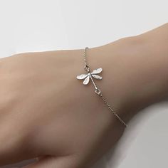 Delicate Silver Metal Chain Bracelet, Delicate Adjustable Silver Chain Bracelet, Elegant Silver Dragonfly Jewelry, Elegant Sterling Silver Dragonfly Jewelry, Dainty Sterling Silver Dragonfly Jewelry, Dainty Silver Dragonfly Jewelry, Elegant Adjustable Dragonfly Jewelry, Delicate Silver Charm Bracelet With Adjustable Chain, Delicate Sterling Silver Charm Bracelet