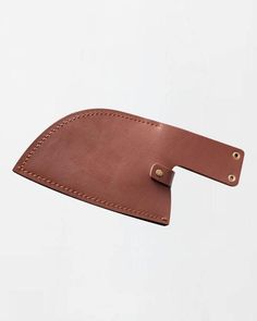 a brown leather luggage tag on a white background