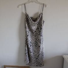 Always Accepting Offers/Counters! :) All Orders Will Be Shipped Within 1-3 Business Days! Smoke And Pet Free Home! Condition: Brand New Without Tags (Never Worn) No Holes/Stains/Pilling/Fading Color: Tan And Black Leopard Print Size: Women's Size Large (L) Measurements: Width-15" Chest- 30" Length- 34" Disclaimer: Measurements Are Approximate Materials: 100% Polyester Cheetah Print Slip Dress, Brown Sleeveless Tiger Print Dress, Leopard Print V-neck Mini Dress For Day Out, Cheap Leopard Print V-neck Dress, Elegant Leopard Print V-neck Mini Dress, Satin Slip, Fade Color, Satin Slip Dress, Leopard Print