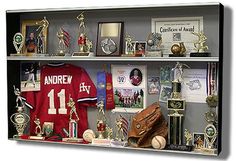 a display case filled with baseball memorabilia and trophies