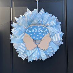 it's a boy wreath hanging on the front door