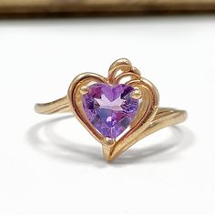 10k Solid Yellow Gold Genuine Amethyst Heart Estate Ring (size 5.75) In Like New Condition Metal: Solid 10K Gold Markings: 10k  size 5.75 Gemstone: Real amethyst - see test pics The Timothy William Peace of Mind Guarantee - Only solid gold vintage items for sale. Never gold plated or gold filled - 45 day free returns! Examine your gold and have it tested. - All Jewelry is either hallmarked 10k, 14k etc or Xray tested for purity - All Jewelry is stored at Securcare and Prime warehouse with insurance - Orders ship within 24 hours of purchase Why buy vintage gold?? - Solid Gold is a class A investment and real solid gold can last forever. - There is no difference in value between new gold and vintage gold. - Vintage Gold in great shape is the ultimate proof of purity and quality. - New gold c Amethyst Heart Cut Ring For Anniversary, Purple Amethyst Birthstone Ring For Valentine's Day, Purple Heart Ring For Anniversary On Valentine's Day, Purple Heart Cut Ring For Anniversary, Purple Amethyst Heart Cut Ring For Valentine's Day, Heart-shaped Amethyst Birthstone Ring, Purple Amethyst Ring For Valentine's Day, Purple Heart Cut Ring For Valentine's Day, Valentine's Day Amethyst Heart Ring With Gemstone