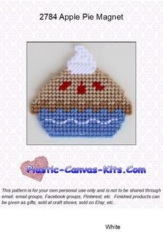 an image of a knitted cupcake with hearts on it's face and the text