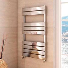 a bathroom with a wall mounted towel warmer