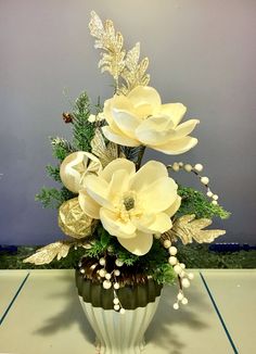 a vase filled with flowers on top of a table