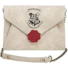 a harry potter envelope with a hogwart's crest on it and a red wax seal