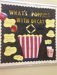 a bulletin board with popcorn and other things on it that say what's popping with deca?