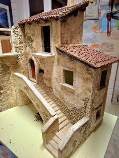 a model of a house made out of clay