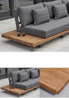 the couch is made out of wood and has grey cushions