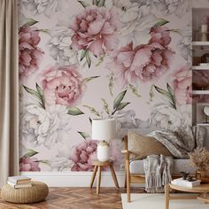 a living room with pink flowers on the wall