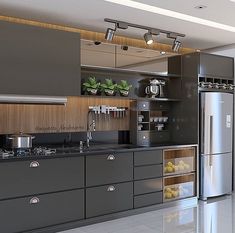 a modern kitchen with stainless steel appliances and cabinets