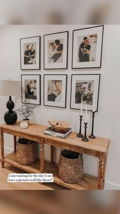 a wooden table with pictures on the wall