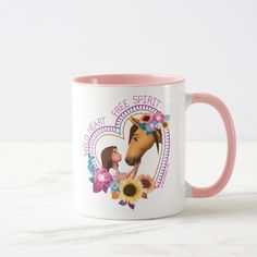 a pink and white coffee mug with an image of a horse kissing a woman's face