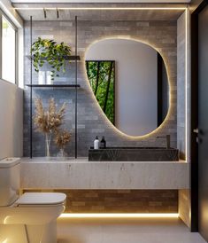 a modern bathroom with a circular mirror above the sink, and a white toilet in front of it