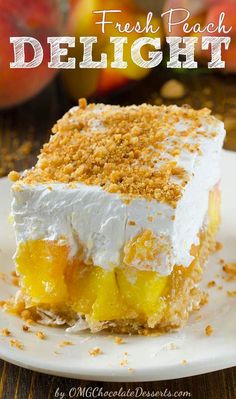 a close up of a piece of cake on a plate with fruit in the background