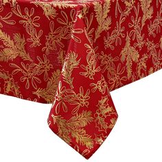 a red table cloth with gold leaves and flowers on it, sitting in front of a white background