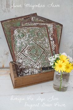 an old wooden box with some flowers in it