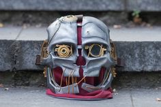 This is Corvo Attano's mask from Dishonored game series by Bethesda studios. This steampunk mask of the main character from Dishonored and Dishonored 2 games, which is corvo attano. This mask is good solution for cosplay events, cosplay parties, and as Halloween accessoir. Inluded: -mask Also in our shop are availiable: Corvo Attano costume: https://www.etsy.com/listing/536333110/ Emily costume: https://www.etsy.com/listing/536334676/ We accept payment plans. ✈️Delivery 🐢Free shipping: 2-4 week Steampunk Costume Accessories For Cosplay Events, Steampunk Costumes For Fantasy Events, Fantasy Costume Mask For Cosplay, Steampunk Costume Accessories For Carnival, Steampunk Costumes For Themed Events, Steampunk Costume Accessories For Fantasy Events, Steampunk Masquerade Mask For Cosplay Events, Steampunk Masquerade Mask For Cosplay And Fantasy Events, Steampunk Masquerade Mask For Fantasy And Cosplay Events