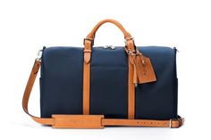 The Monaco Weekender - Navy and Tan Luxury Luggage With Adjustable Strap For Trip, Classic Everyday Travel Accessories With Leather Trim, Classic Tote Travel Bag For Overnight Trips, Luxury Travel Bag With Leather Trim For Weekend Trips, Classic Travel Tote Bag For Overnight Trips, Luxury Luggage With Leather Trim For Overnight Trips, Classic Tote Weekender Bag For Overnight Trips, Luxury Weekender Bag With Luggage Sleeve For Travel, Classic Travel Bag With Luggage Sleeve For Overnight Trips