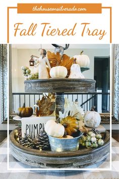 fall tiered tray with pumpkins, gourds and other decorations on it