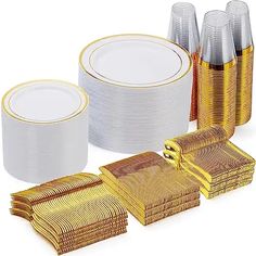 gold and white dinnerware set with matching napkins