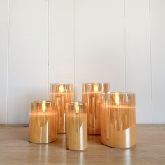 Flameless Gold Glass Ivory Pillar Multiple Sizes Gold Battery Candle, Gold Flameless Candles, Brown Flameless Candles, Short Gold Candle Holder, Boxwood Garland, Ivory Pillar Candles, Flameless Candle Set, Wooden Planters, Wood Wall Clock