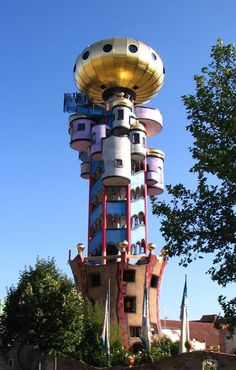 a tall tower with lots of windows and balconies on it's sides