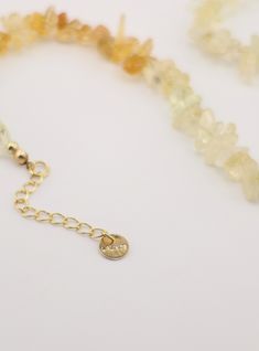 This stunning Citrine Necklace features a handcrafted design and a raw ombre citrine stone, symbolizing the November birthstone. Expertly created and unique, this necklace is the perfect addition to any jewelry collection. Elevate your style and embrace the beauty of this natural gemstone. Citrine is a rare variation of quartz. The colors range from the transparent, from light yellow to bright orange Adjustable Amber Citrine Necklace, Adjustable Citrine Necklaces For Healing, Citrine Healing Jewelry With Stones, Amber Citrine Gemstone Necklace, Amber Citrine Jewelry With Natural Stones, Spiritual Citrine Gemstone Beaded Jewelry, Spiritual Citrine Gemstone Beads Jewelry, Adjustable Citrine Gemstone Jewelry, Unique Citrine Necklace With Natural Stones