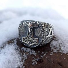 The Mjolnir ring is made by hand casting from Silver solid (without stamp). The Thors hammer version was taken from archeological artefact found in Skane (Sweden). Thurisaz runes are depicted on the sides of signet ring. Thurisaz rune is rune of Norse God Thor and it means courage. If you like Nordic or Viking jewelry for men or women - you`ll like this signet ring. Description of Mjolnir silver ring: Material : Sterling silver solid (92.5% silver, 7.5% copper) without stamp. The ring is made fo Thurisaz Rune, Nordic Jewelry, Viking Cosplay, Hunting Wedding, Viking Warriors, Hand Casting, Mens Ring Designs, Norse Jewelry, Cosplay Jewelry