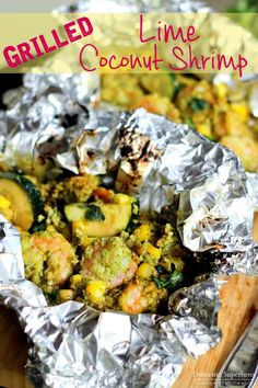 grilled lime coconut shrimp in foil with zucchini and corn on the side