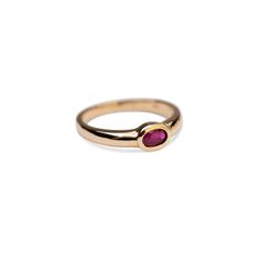 14k Gold Ruby Bezel Ring Our new stunning 14k Gold Ruby Bezeled Ring is beautiful ring that stands alone with its stunning deep red hues. Hand set by us, for you in our simple yet timeless 14k Bezel Ring. Band Width: 5.25mm tapering down to 3.25mm at the shank Bezel Size: 6mm x 4mm Built to last a lifetime and more. Due to the handmade nature of this ring, please allow 1 - 3 weeks for processing. Ruby Bezel Ring, Classic Sapphire Ring With Smooth Bezel, Elegant Red Stackable Rings With Bezel Setting, Classic Red Rings With Bezel Setting, Classic Red Ring With Bezel Setting, Formal Red Rings With Bezel Setting, Classic Red Bezel Set Ring, Classic Red Birthstone Stackable Rings, Classic Formal Birthstone Ring With Smooth Bezel