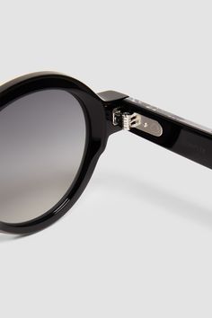 Meticulously crafted from acetate, subtle logo accents infuse the Rondosa sunglasses with a refined edge. Boasting a rounded shape with a black frame and dark gray lenses, the eyewear moves easily from casual to elegant occasions. The shades can be adapted for prescription lenses. Luxury Round Sunglasses With Mirrored Lenses, Luxury Sunglasses With Polarized Round Frame, Luxury Polarized Round Frame Sunglasses, Luxury Round Sunglasses With Gradient Lenses, Black Round Frame Sunglasses, Round Frame Sunglasses With Gradient Lenses In Acetate, Luxury Rimless Shield Sunglasses, Modern Black Round Sunglasses, Black Sunglasses With Gradient Lenses And Round Frame