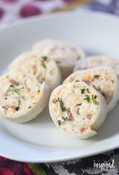 some food is sitting on a white plate