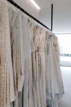 there are many dresses hanging on the rack