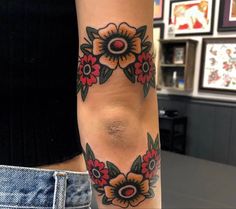 a woman's arm with flowers on it