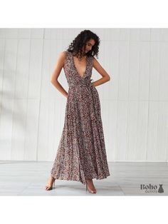 A bohemian dress with a flower motif that is long and stylish. You'll undoubtedly draw attention in this long and stylish bohemian dress! We like how it has a wraparound fit and a matching ribbon belt to help you define your body form. The flowing fabric below the waistline moves to the beat of your steps. The maxi length flatters your figure, and the flowery print gives the outfit a bohemian vibe. This bohemian floral maxi dress for ladies is ideal for a city outing, a special celebration, or a