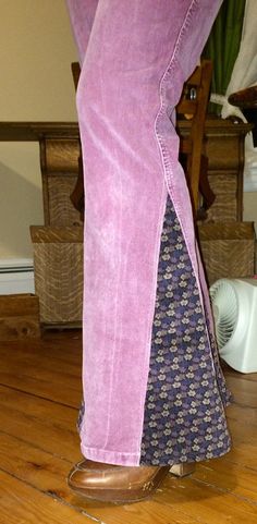 a person standing on top of a wooden floor