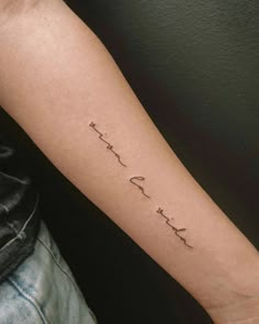 a person with a tattoo on their arm that says, i love you in cursive writing