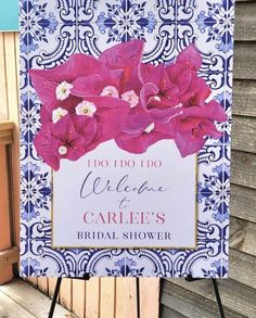 a sign with flowers on it that says do i do, welcome to the bride's bridal shower