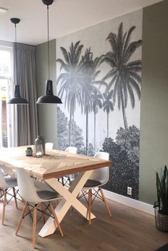 an image of a dining room with palm trees painted on the wall and chairs around it