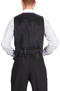 Men vest, Tango vest, Black waistcoat, Button vest, Men suit vest, Men gilet, Men dance costume, Ballroom dancing, Elegant vest, Fitted vest Men's Plain Black Tango Vest With Satin Back by conDiva A classic design ideal for argentine tango dancers. It features a six-button fastening, two decorative front pockets and a back strap for an adjustable fit. The back is made from black lining fabric. Additional details: * Plain black color * 2 non-functioning front pockets * Back made from satin fabric Tuxedo Style Business Vest Sleeveless, Sleeveless Tuxedo Vest For Business, Fitted Sleeveless Vest For Semi-formal Occasions, Black Sleeveless Vest For Tailoring, Fitted Sleeveless Suit With Vest, Classic Black Vest For Party, Classic Black Party Vest, Fitted Black Suit With Vest, Black Sleeveless Suit With Vest