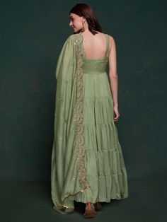 Introducing our amazing sea green georgette mehendi wear gown with a heavy dupatta! This beautiful green gown is perfect for all your festive occasions, from Mehendi ceremonies to festivals and special events. The gown is made of high-quality georgette fabric and comes fully stitched in sizes ranging from XS to XXL, ensuring a perfect fit for everyone.
This stunning gown includes a similar color georgette dupatta with intricate sequin work, thread embroidery, and designer lace work. This adds a Eid Green Floor-length Maxi Dress, Green Floor-length Maxi Dress For Eid, Green Floor-length Festive Maxi Dress, Green Floor-length Maxi Dress For Festive Occasions, Traditional Green Maxi Dress For Festive Occasions, Traditional Green Festive Maxi Dress, Traditional Green Maxi Dress For Wedding, Green Bollywood Style Dress For Reception, Green Bollywood Dress For Reception