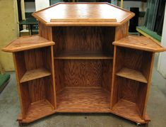 a wooden shelf sitting inside of a building